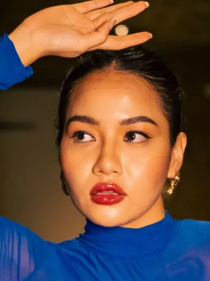 A duplicate image for context. A close-up of the glossy red lip from the "blue dress" shoot.