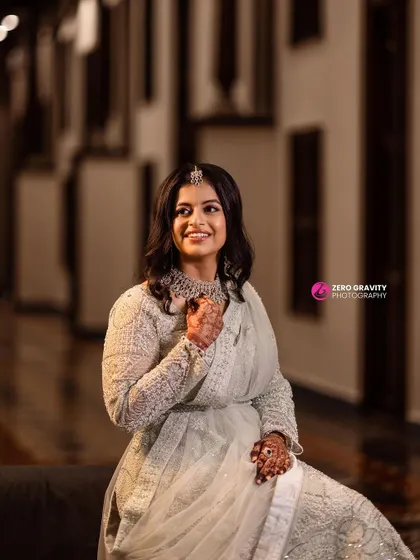 A happy and confident bride at her reception. The makeup is understated yet glamorous, perfect for a modern bride.