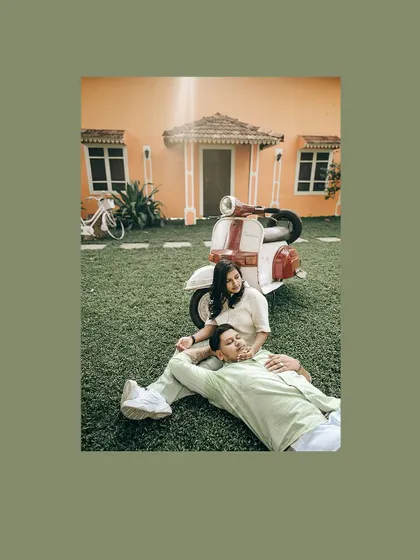 A fun and stylish pre-wedding shot with a couple and a vintage scooter in front of a colorful house.