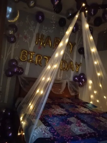 In low light, the fairy light canopy creates a warm and magical glow, perfect for a romantic birthday evening.