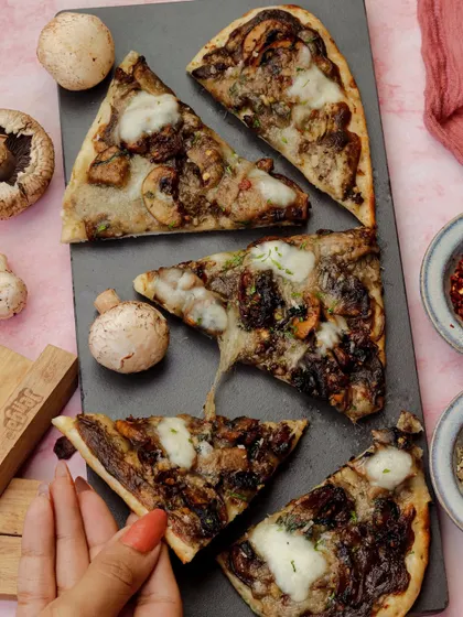 A heart-shaped mushroom flatbread, a savoury and creative option for a Valentine's dinner.