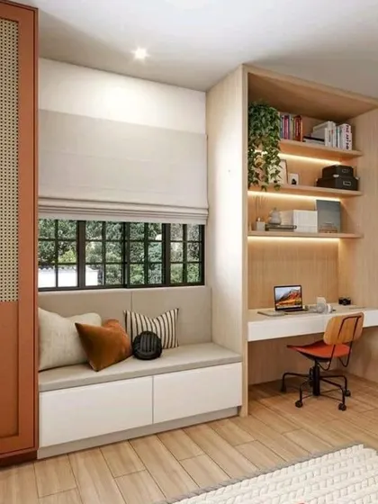 A compact and efficient home office nook. This design combines a window seat with an adjacent built-in desk and shelving, perfect for working from home.