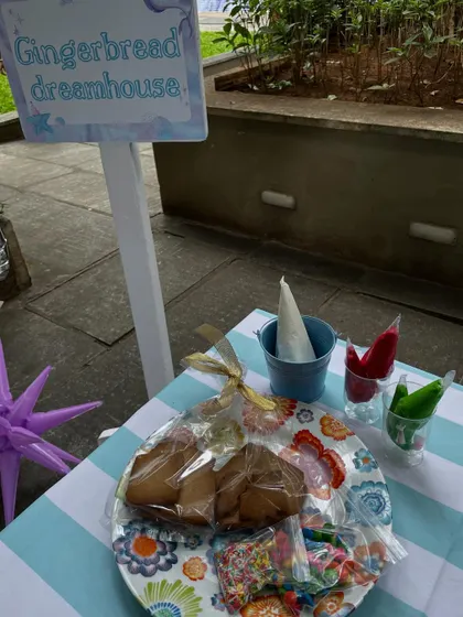 A gingerbread dreamhouse activity station at an under-the-sea party. This shows how I incorporate fun, hands-on activities that are perfectly integrated with the event's theme.