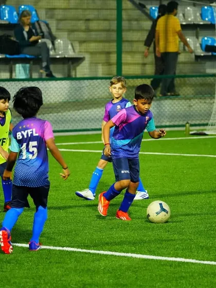 Players competing for the ball during a training match. This healthy competition pushes everyone to improve.