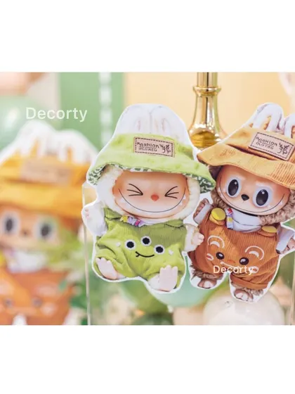 Small Labubu character cutouts used as decorative accents within the party setup.