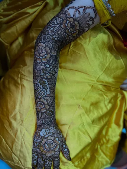 A full-arm view of the signature floral design, showcasing its elegance and extensive coverage.
