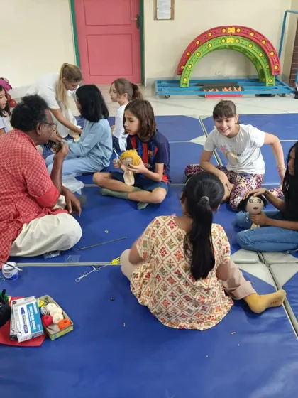 Sharing our Indian art with children from other countries is a special experience. Here I am with a group of French students during a workshop in Bangladesh.