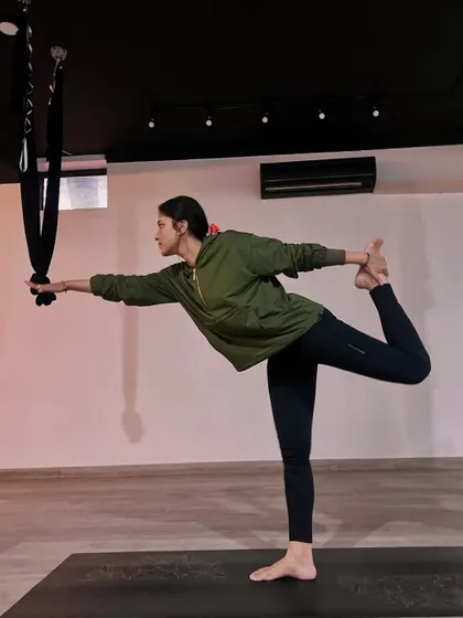 Yoga is for the alignment of the body, mind, and soul, leading to more conscious living. This supported dancer's pose helps find balance and focus.
