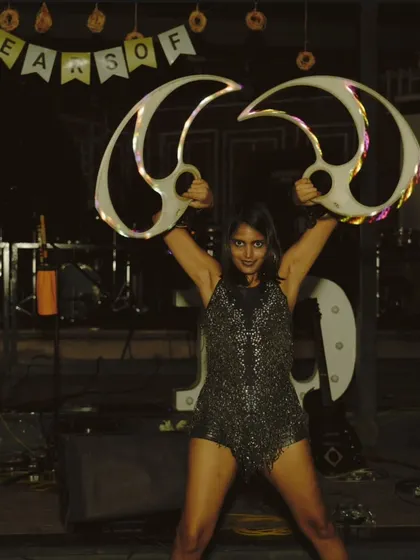 A powerful pose with the LED fans at the corporate event. These props are great for indoor venues where fire isn't an option.