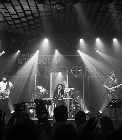 A black and white shot that captures the mood of the venue. The lighting, the stage, the audience, it all comes together.