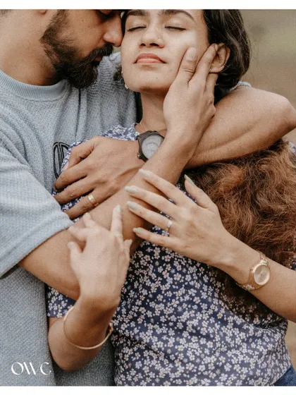 An intimate close-up of a couple's embrace, focusing on the tender connection and emotion.