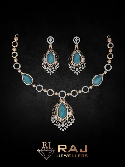 Part of our Verona Collection, this necklace features large, teardrop-shaped blue stones set within a frame of sparkling CZs. The design is classic and elegant, evoking timeless romance.