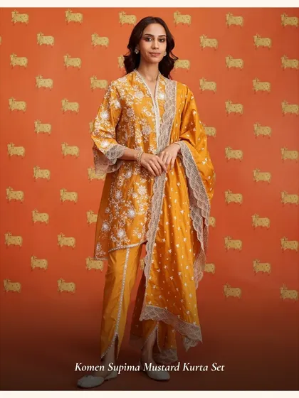 The Komen Supima Mustard Kurta Set is another great option for Karwa Chauth, with its warm color and intricate white embroidery.