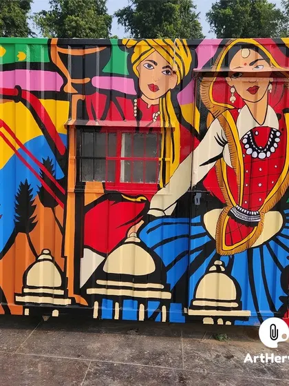 This side of the container showcases a beautiful depiction of traditional Indian dancers. The bright colors and bold outlines make the artwork visible and engaging even from a distance.