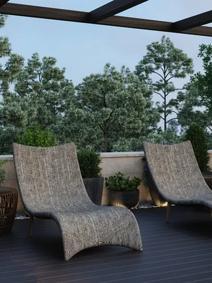 A row of ergonomic chaise lounges on a wooden deck, creating a resort-like atmosphere for sunbathing and relaxing on the rooftop.