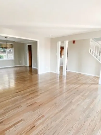 A light, natural wood floor keeps this open-concept home feeling bright and connected. My installation runs seamlessly from the entryway through the living space, creating a unified and expansive feel.