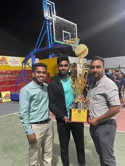Holding the third-place trophy at the Champions Cup Pune 2020.