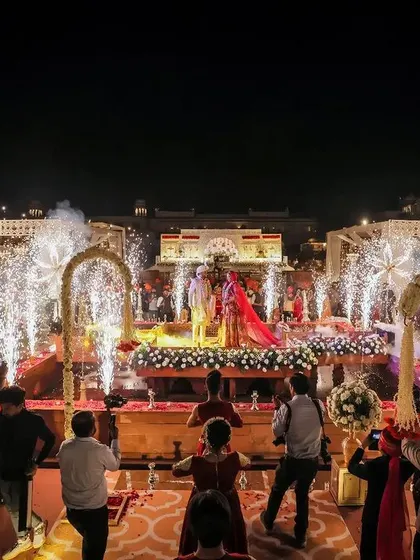 The grand varmala ceremony at a destination wedding, complete with sparklers.