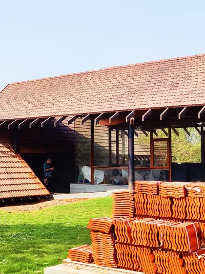 The final touches are being put on our Alibaug residence. Stacks of traditional Mangalore tiles wait to be laid, a key material choice that connects the home to the local architectural vernacular.