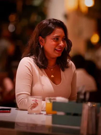 A guest enjoying the festive atmosphere on New Year's Eve. The warm lighting and happy crowd created a truly special and memorable night.