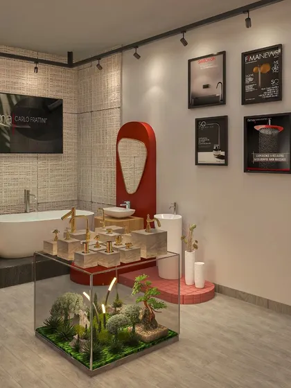 This visualization showcases another corner of the showroom, where a freestanding tub is paired with a red statement mirror and framed product art. The design mixes textures like jute wall coverings with sleek fixtures.