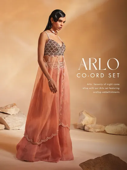 The Arlo Co-ord Set comes alive with scallop embellishments and pearl detailing. I designed this set with a unique layered silhouette for a serene yet striking effect.