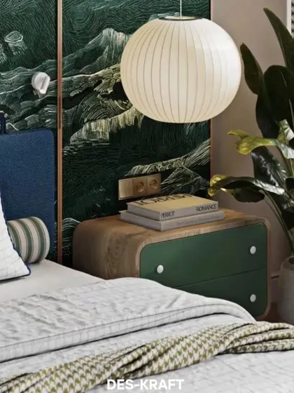 A close-up of the bedside table, which features curved wood and green drawers, paired with a paper lantern pendant light for a soft, organic feel.