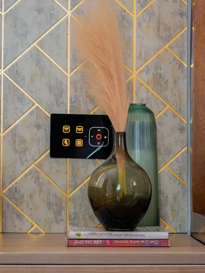 Our black smart panel with yellow icons set against a stylish gray and gold wallpaper. The customization options ensure it complements your interior design.