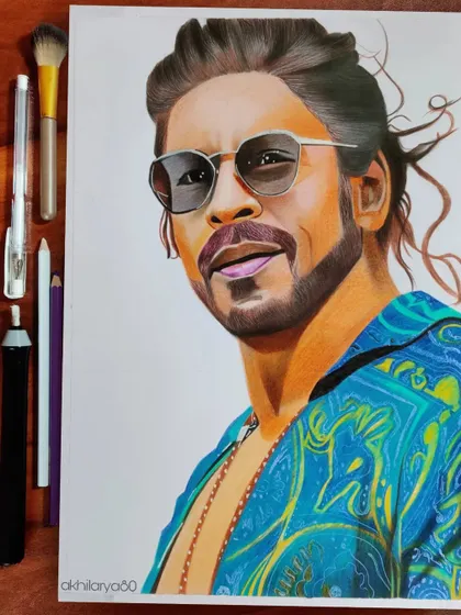My colored pencil artwork of Shah Rukh Khan from the movie Pathaan. I used vibrant colors on A4 paper to capture his cool and stylish look.