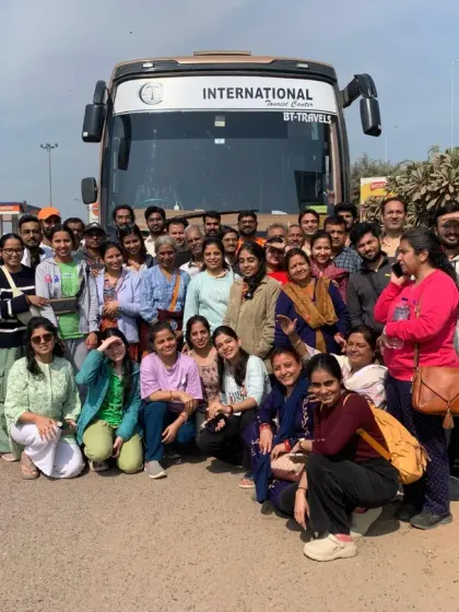 Our entire travel group posing in front of our bus before heading to the Kumbh grounds. We travel as a community, supporting each other on this incredible journey.