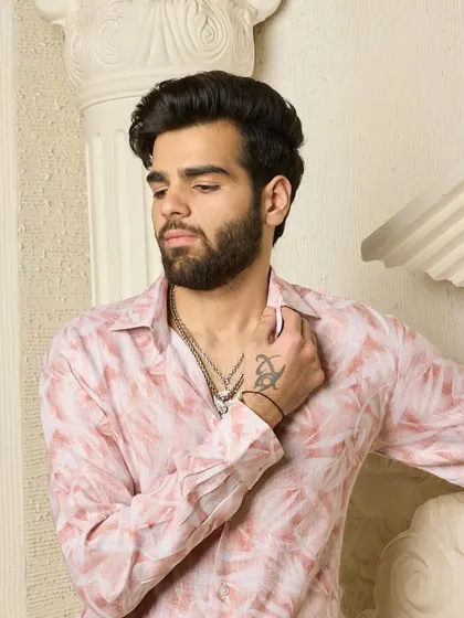 This pink patterned shirt combines comfort with modern charisma. It is a versatile piece that ensures you look sharp and feel confident, whether at work or a special occasion.