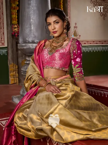 The Brindavanam blouse in rich rani pink, featuring hand-embroidered vines and sacred lotuses that echo the divine romance of Radha and Krishna.