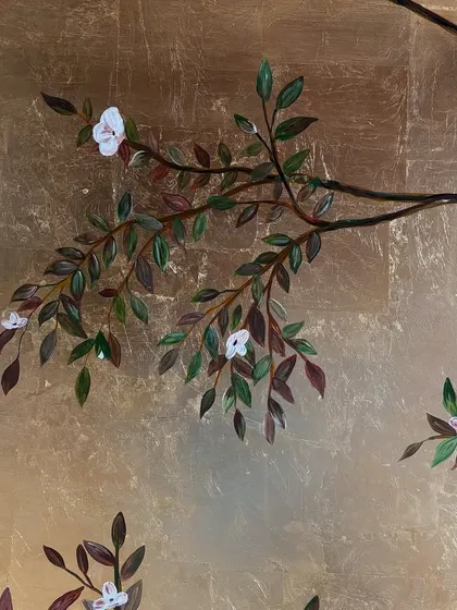 Another detail shot showing the delicate interaction between the painted leaves and the metallic background. Each leaf is carefully shaded to give it depth.
