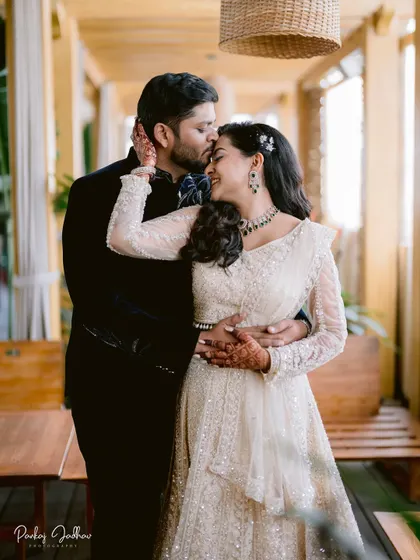 A tender kiss on the forehead. This intimate moment between Swati and Sarthak during their engagement shoot captures the love and affection that the celebration is all about.