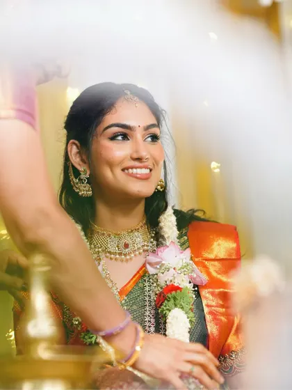 A candid, happy moment during the engagement ceremony. Her natural-looking makeup ensures she looks like herself, just with an extra touch of radiance.