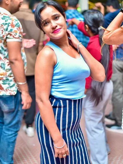 A guest looking cool and casual while enjoying the music.