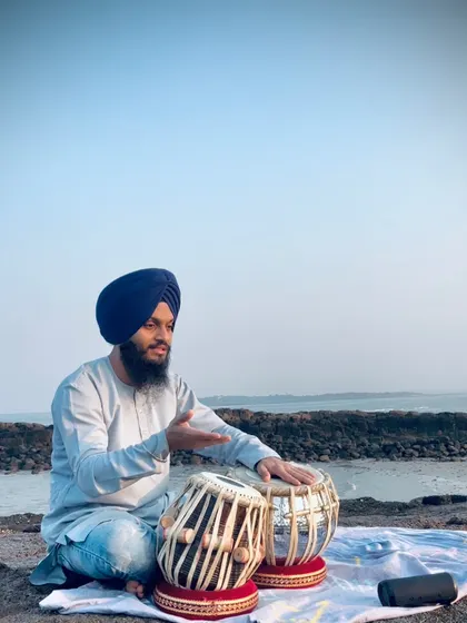 Explaining a rhythmic concept or 'bol' during my outdoor practice session.