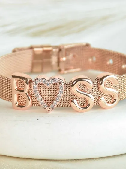 For the one in charge. The 'BOSS' bracelet, featuring a sparkling pavé heart charm on a rose gold mesh band, is a daily reminder of your power.