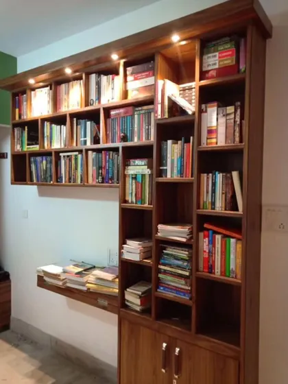 Not just a bookshelf, a whole vibe! This custom wooden bookshelf features integrated lighting and a fold-down desk, making it both beautiful and highly functional.