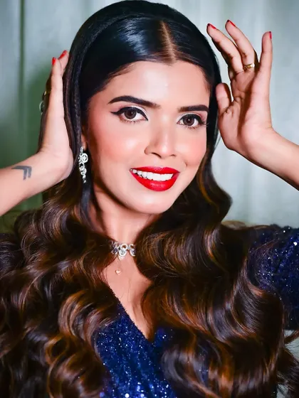 A bright, happy smile that shows how the makeup looks when expressing joy. The look is both sophisticated and approachable.