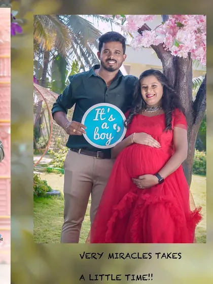A joyful gender reveal for a baby boy. This couple is celebrating under a beautiful cherry blossom tree setup outdoors.