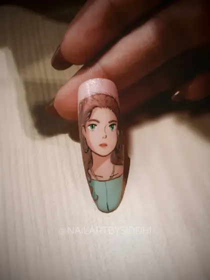 A delicate hand-painted anime-style portrait on a single nail, showing my versatility in different character art styles.