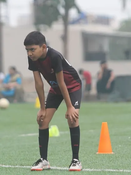 The look of determination. A player catches his breath during a drill at our Summer Camp, ready for the next challenge.