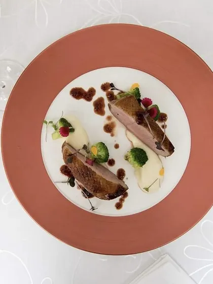 A pan-seared duck breast, cooked to perfection with a crispy skin. This is another example of the European influences on our Mediterranean menu.