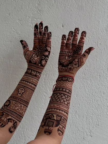 Another view of the personalized design, showing how different elements like jharokhas and lotuses are woven together to create a unique story.
