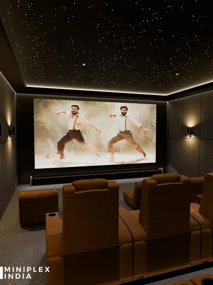 Watching a vibrant movie like RRR in the 'Stellar Luxe' theater. The acoustically treated walls and Dolby Atmos sound system make the dynamic soundtrack and dance numbers feel incredibly immersive.