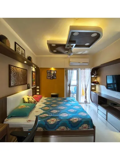The integrated design of the bedroom furniture provides ample storage and display space without cluttering the room.