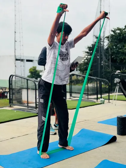 Physical training goes beyond the gym. Our athletes participate in group warm-ups, stretching sessions, and running drills on the course to build functional fitness.