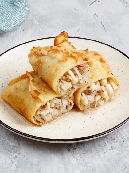 A closer look at our sweet coconut-filled rolls, a perfect dessert to balance out a spicy meal.
