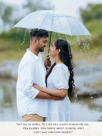 A couple gazes at each other under a clear umbrella as gentle rain falls around them. This is a perfect example of a cinematic, romantic shot that tells a story.